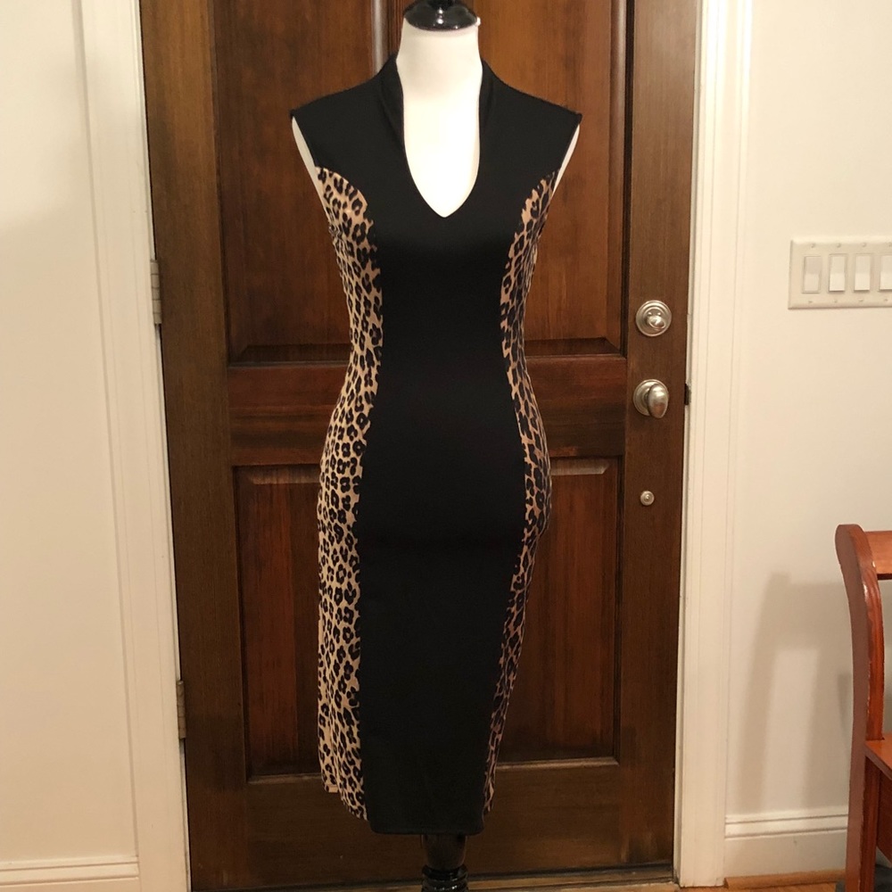 Form-flattering black and leopard print dress.